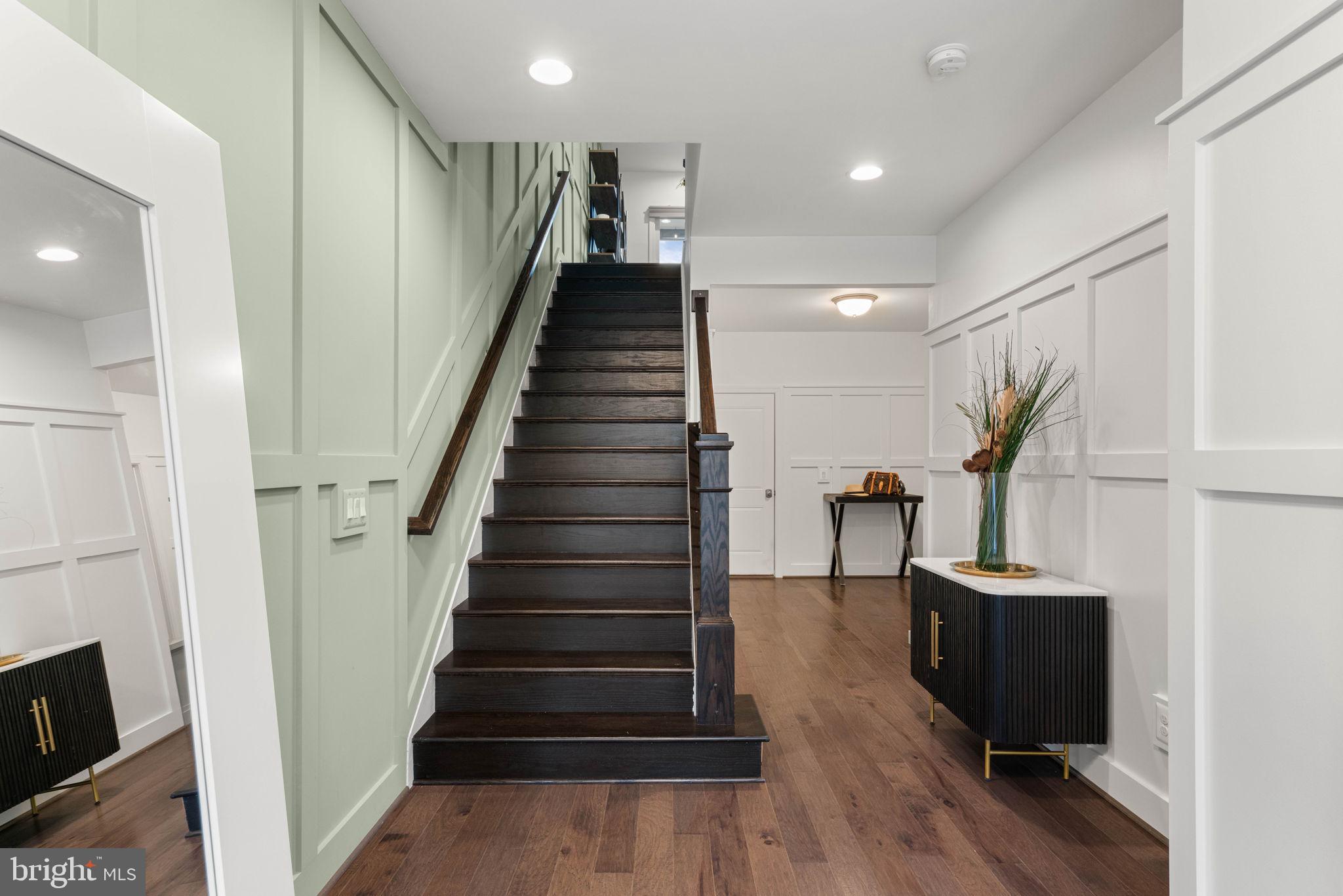 20379 Codman Drive Ashburn, VA 20147 - Photo 6 of 57 Custom designed board-and-batten accent wall