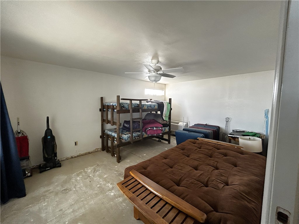 65 2nd Street Needles, CA 92363 - Photo 13 of 14 a living room with furniture and a chandelier