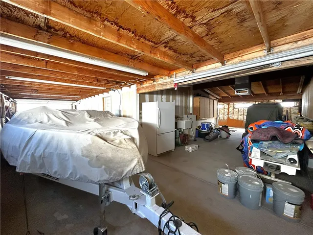 a view of parking garage with cars