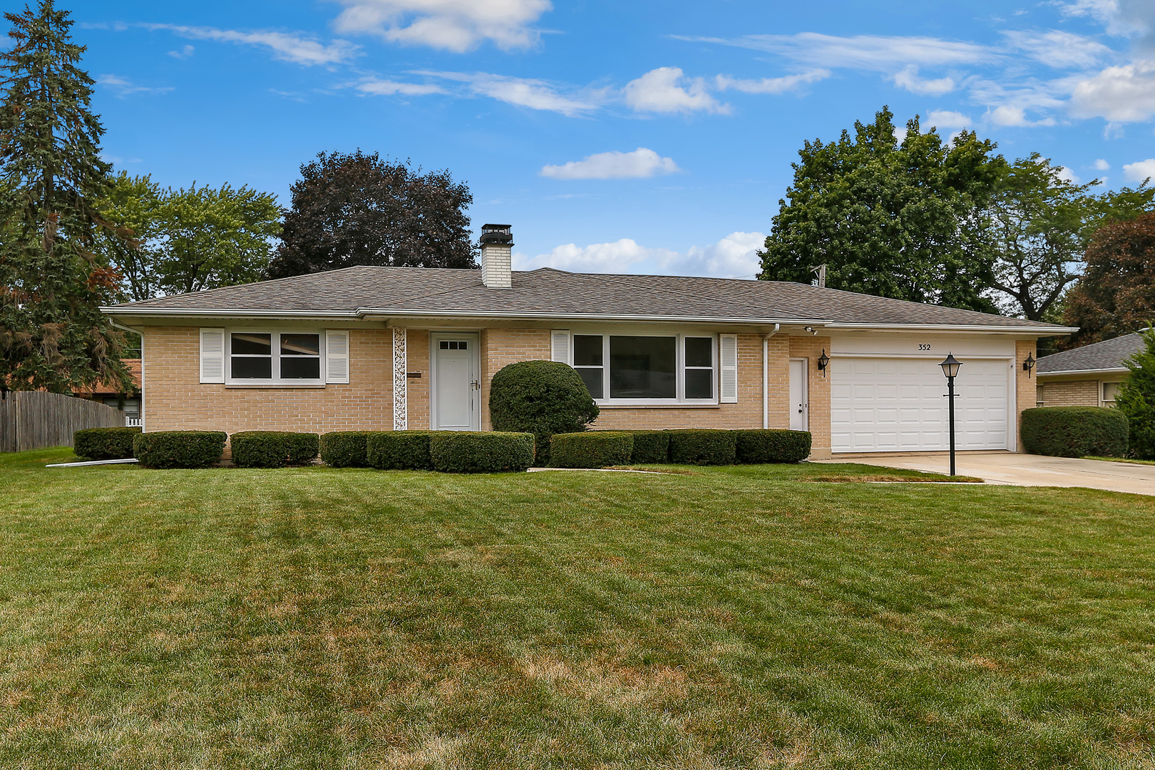 352 North Alfred Avenue Elgin, IL 60123 - Photo 1 of 20 a house view with a garden space