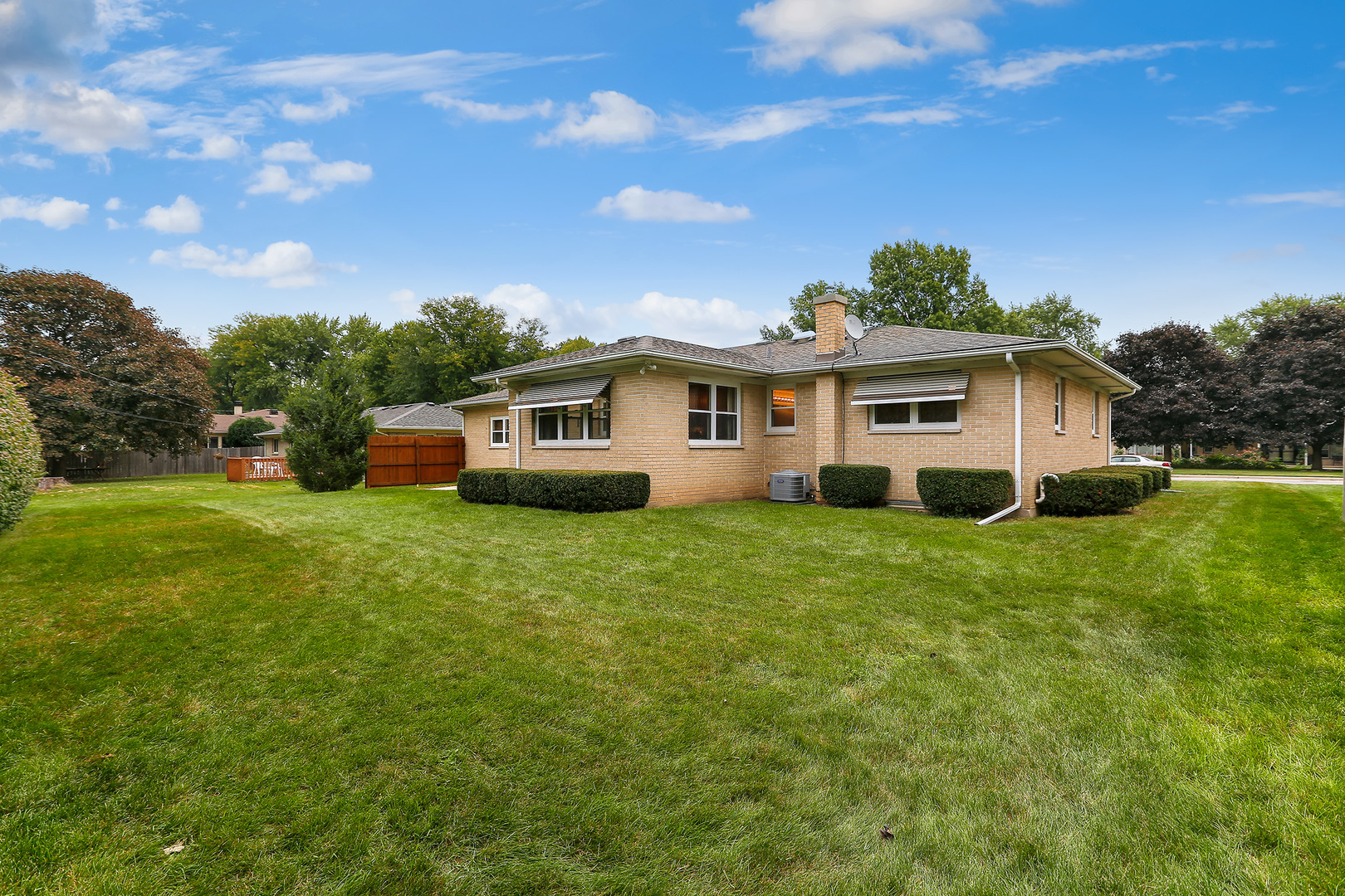 352 North Alfred Avenue Elgin, IL 60123 - Photo 18 of 20 a view of a house with backyard sitting area and garden