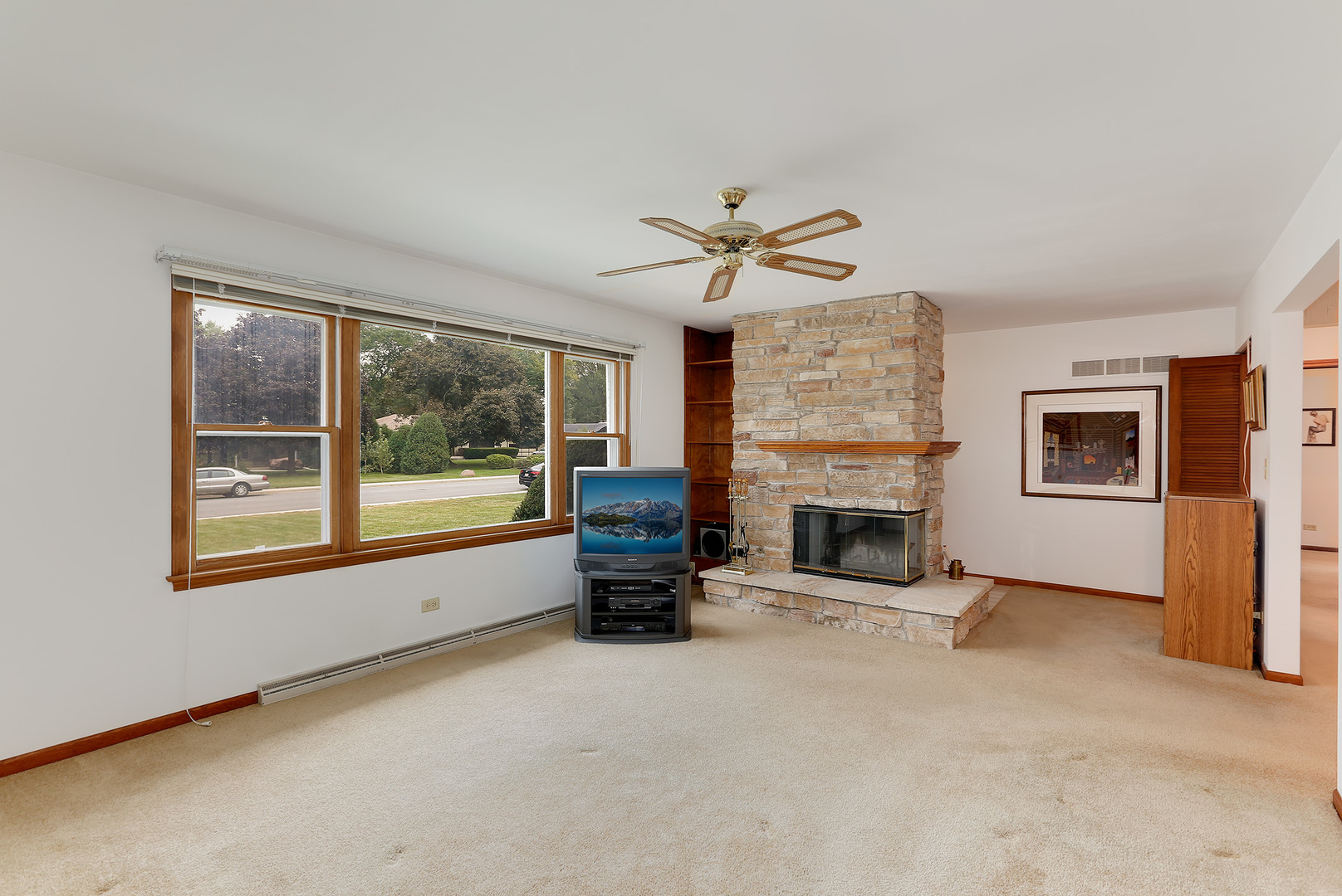 352 North Alfred Avenue Elgin, IL 60123 - Photo 3 of 20 a view of a livingroom with a fireplace a fireplace and windows