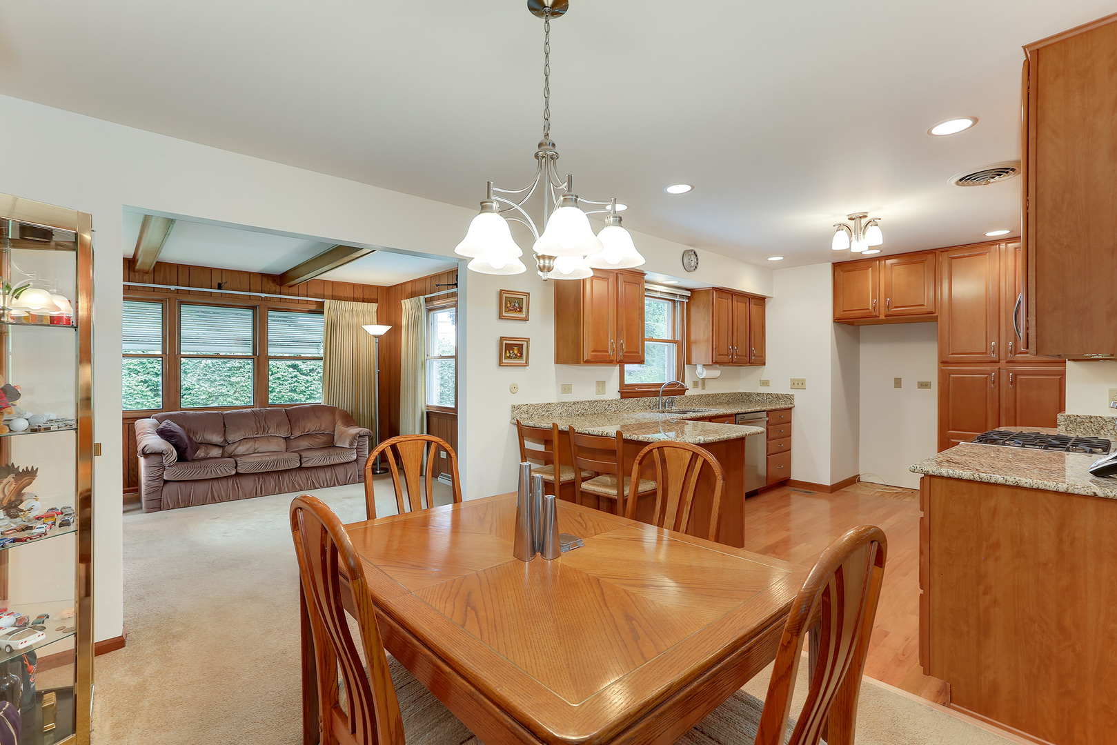 352 North Alfred Avenue Elgin, IL 60123 - Photo 8 of 20 a dining room filled chandelier and wooden furniture