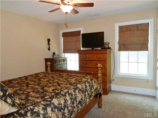 212 Bickett Boulevard Raleigh, NC 27608 - Photo 11 of 20 Large 3rd bedroom with ceiling fan, 2 door closet, and frieze carpet.