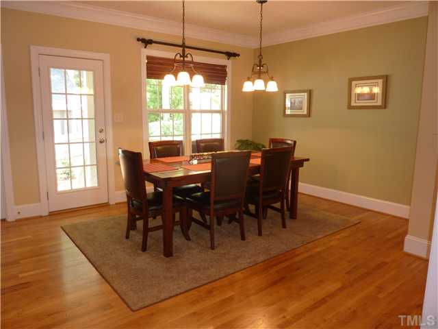 212 Bickett Boulevard Raleigh, NC 27608 - Photo 4 of 20 Large, light and bright dining room is perfect for entertaining. You can walk right out the door to the relaxing back porch and patio. Hardwoods, crown molding, 9 foot ceilings.