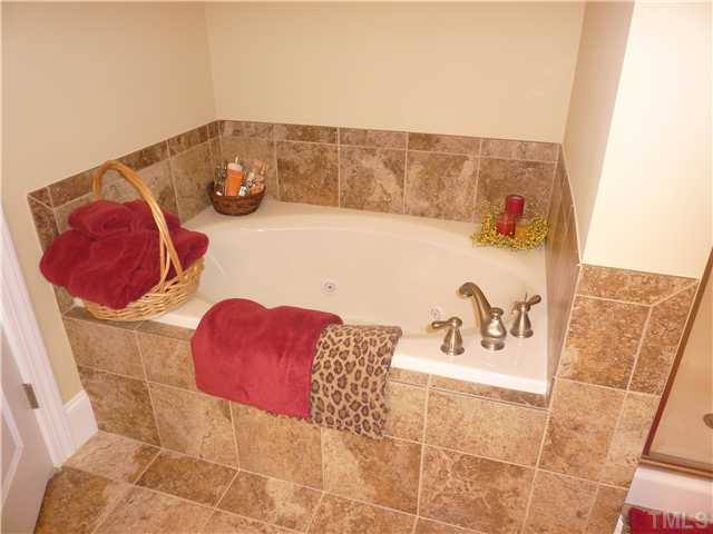 212 Bickett Boulevard Raleigh, NC 27608 - Photo 8 of 20 Relax in a candle lit bubble bath with a glass of wine in your custom tiled jacuzzi tub!