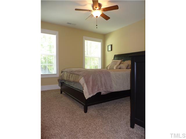 212 Bickett Boulevard Raleigh, NC 27608 - Photo 10 of 20 Spacious secondary bedroom with ceiling fan and 2" faux wood blinds.
