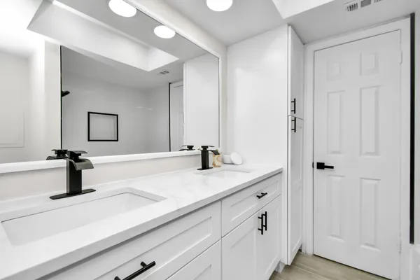 a bathroom with a sink and a mirror