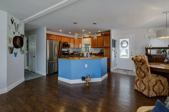 a living room with fireplace furniture and a wooden floor