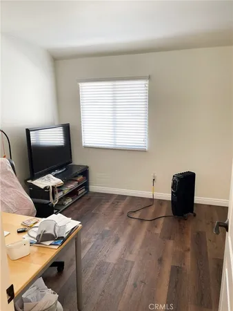 a room with a workspace and a window