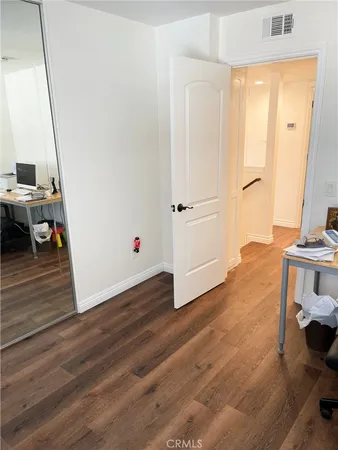 a view of kitchen and dining room with wooden floor