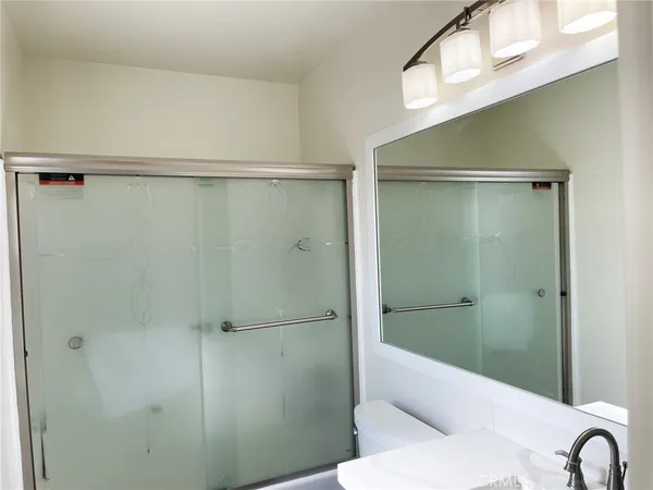 a bathroom with a shower and a toilet