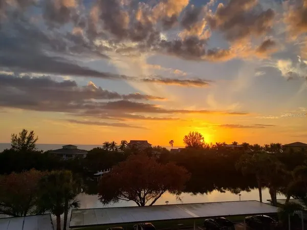 a view of a chair and table in the balcony