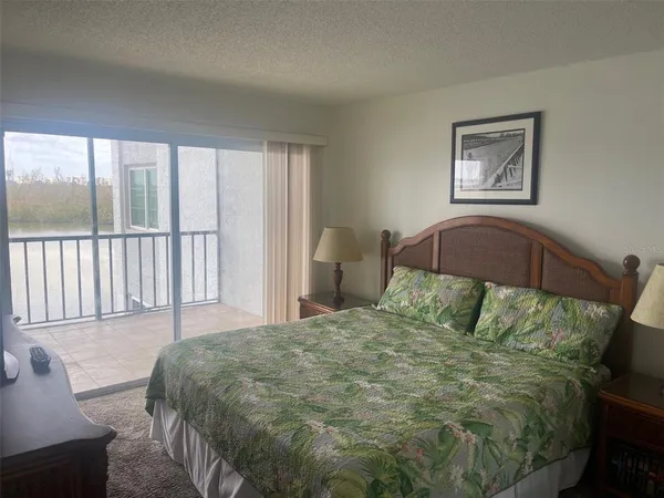 a view of a living room and a floor to ceiling window