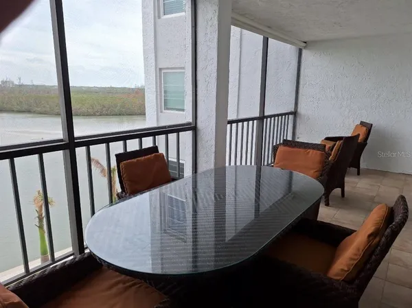 a view of a balcony with chairs