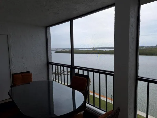 a view of swimming pool from a balcony