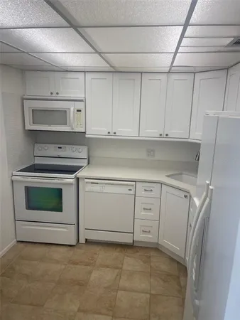 a view of a balcony with chair and wooden floor