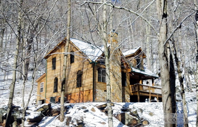 3075 Meat Camp Road Boone, NC 28607 - Photo 6 of 17 a view of a house with a yard covered in snow