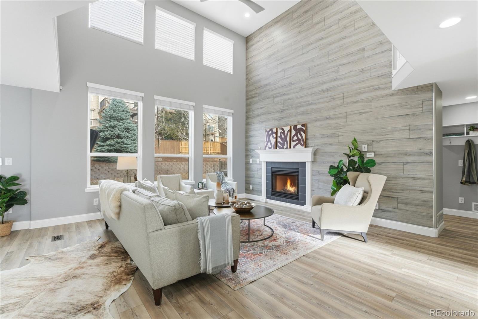 6621 Millstone Place Highlands Ranch, CO 80130 - Photo 19 of 48 a living room with furniture and a fireplace