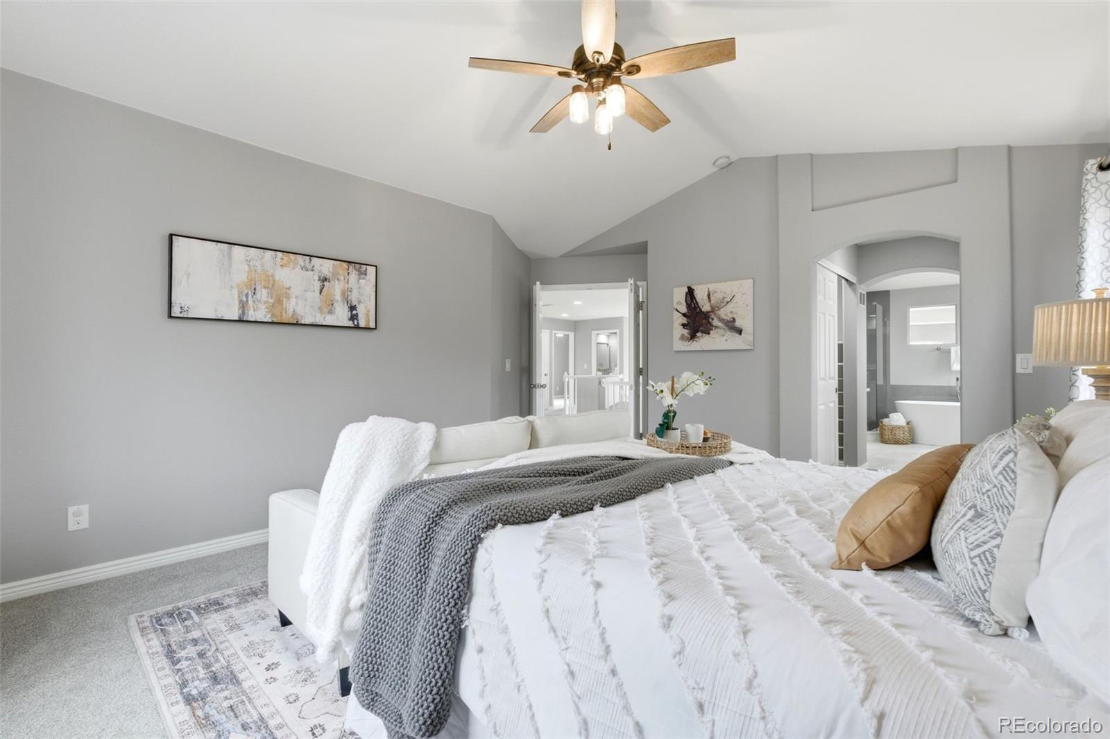 6621 Millstone Place Highlands Ranch, CO 80130 - Photo 27 of 48 a bedroom with a bed and a chandelier