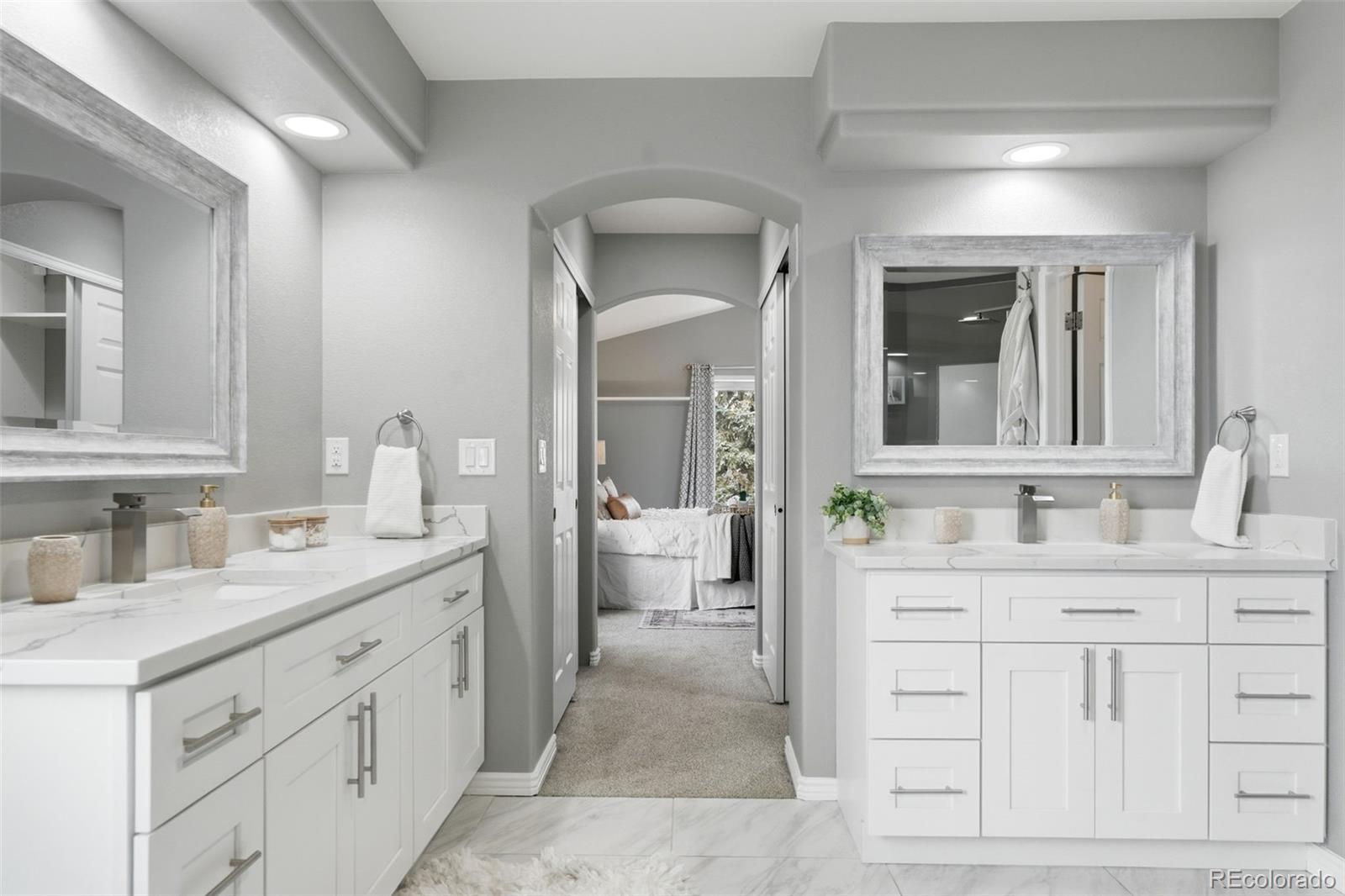 6621 Millstone Place Highlands Ranch, CO 80130 - Photo 31 of 48 a bathroom with a sink a toilet and a mirror