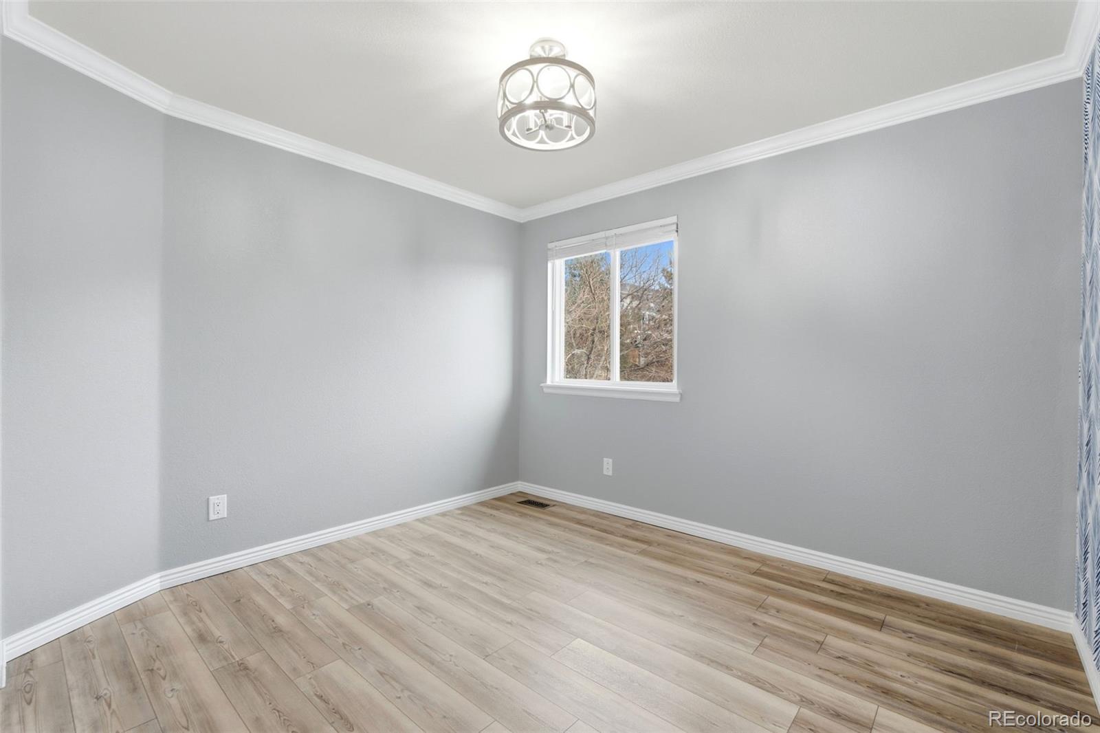 6621 Millstone Place Highlands Ranch, CO 80130 - Photo 34 of 48 an empty room with a window
