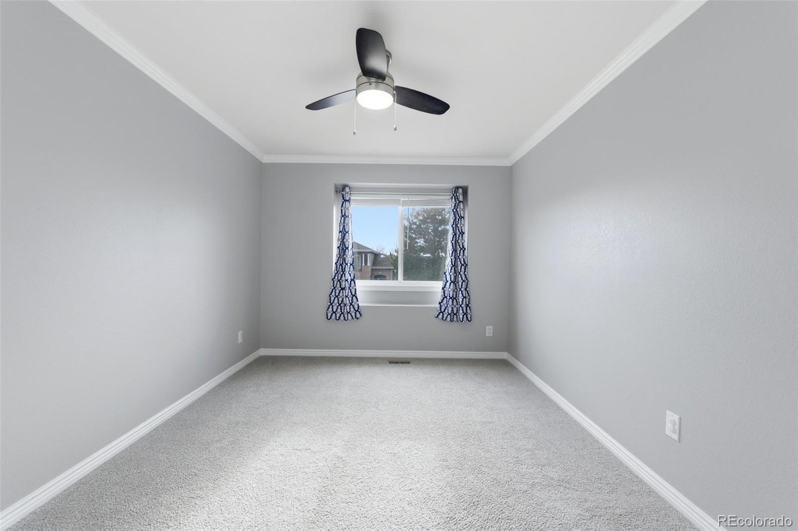 6621 Millstone Place Highlands Ranch, CO 80130 - Photo 37 of 48 an empty room with a window