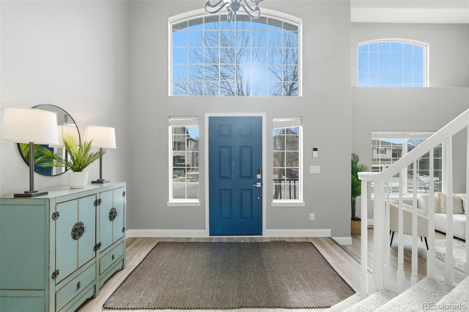 6621 Millstone Place Highlands Ranch, CO 80130 - Photo 4 of 48 a view of an entryway with wooden floor