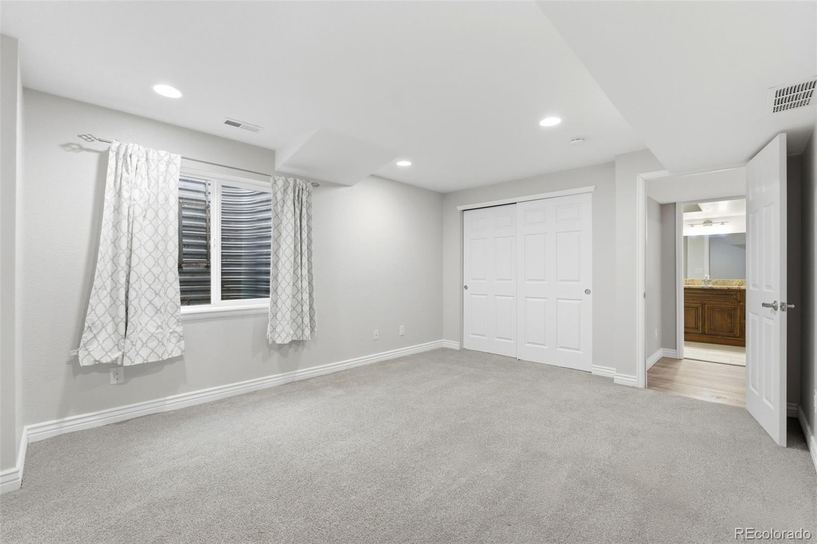 6621 Millstone Place Highlands Ranch, CO 80130 - Photo 41 of 48 a view of an empty room with a window