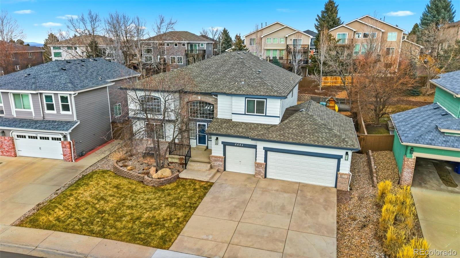 6621 Millstone Place Highlands Ranch, CO 80130 - Photo 46 of 48 front view of a house with a yard