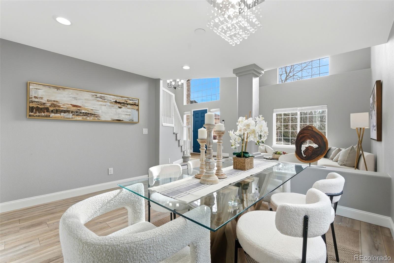 6621 Millstone Place Highlands Ranch, CO 80130 - Photo 9 of 48 a dining room with furniture and a chandelier