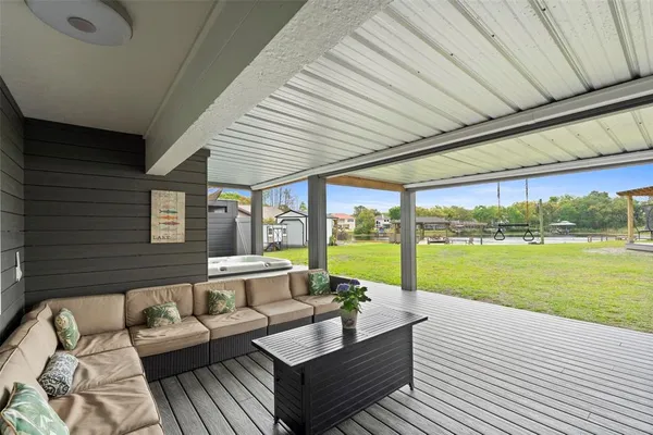 a view of swimming pool with outdoor seating