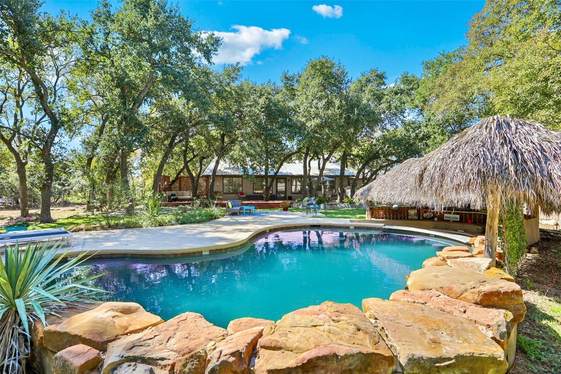 2858 Cedar Hollow Road Georgetown, TX 78628 - Photo 1 of 1 a view of a lake with a house