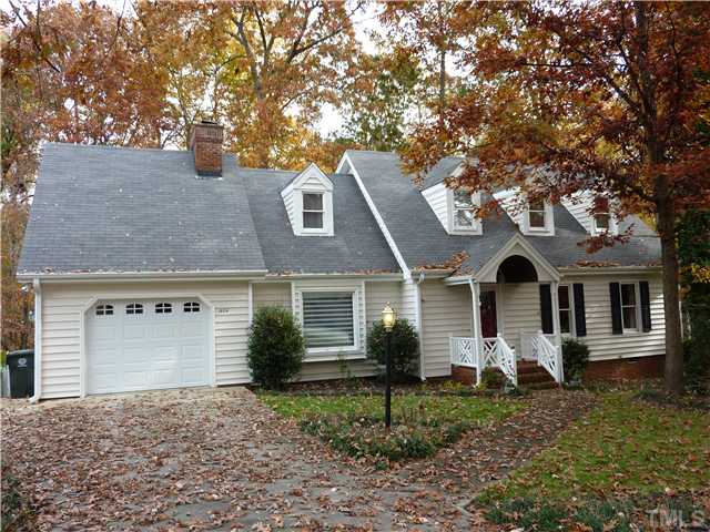 1924 Wilton Circle Raleigh, NC 27615 - Photo 1 of 22 a front view of a house with a yard