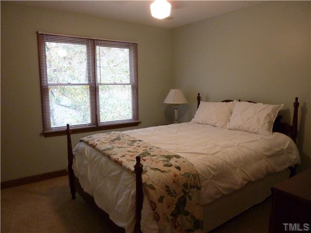 1924 Wilton Circle Raleigh, NC 27615 - Photo 13 of 22 a bedroom with a bed and a window