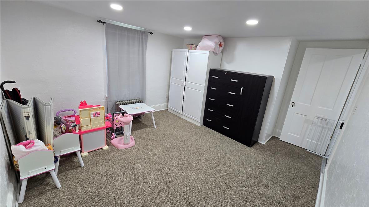 883 North Locust Street Hazleton, PA 18201 - Photo 48 of 83 Well-lit room with recessed lighting and comfortable carpeting, offering versatile space for various needs.