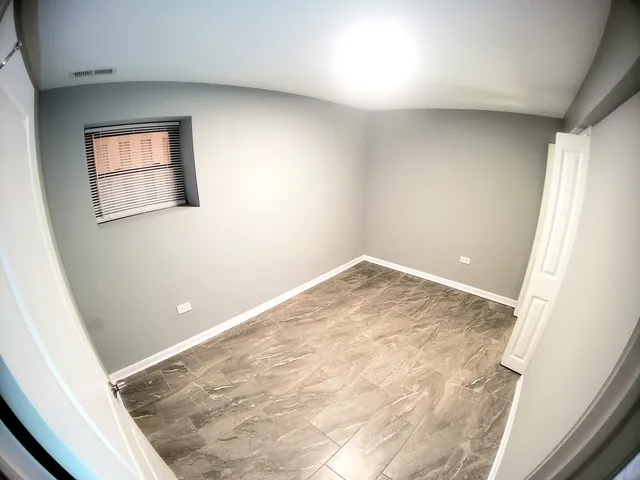 a view of a livingroom with wooden floor and stairs