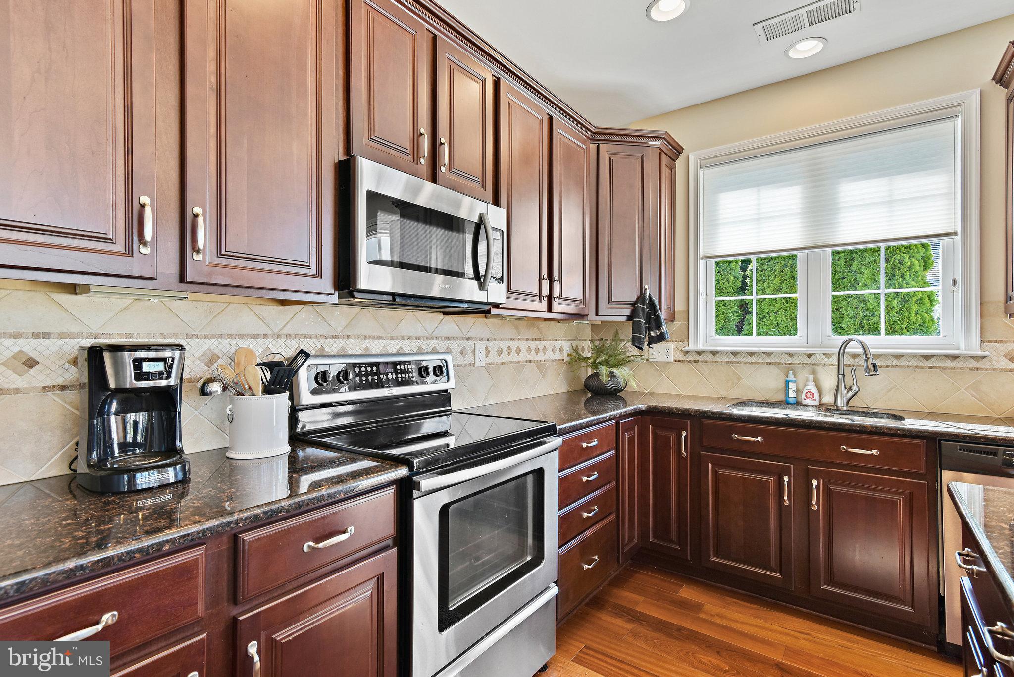 44357 Maltese Falcon Square Ashburn, VA 20147 - Photo 10 of 30 Stainless appliances and tile backsplash