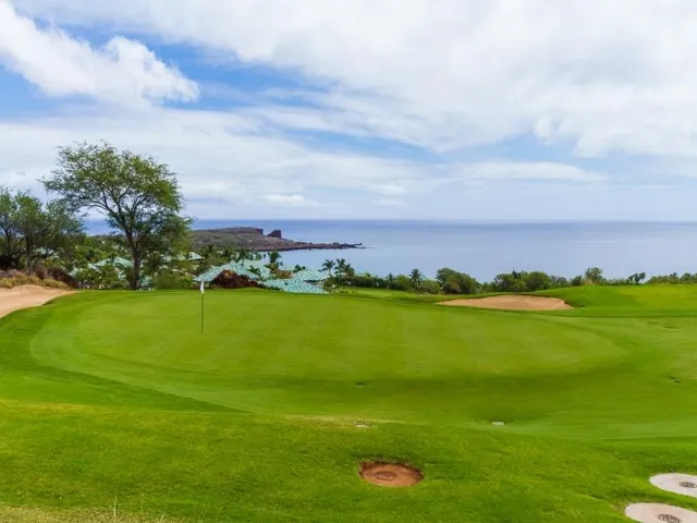 a view of an ocean and city