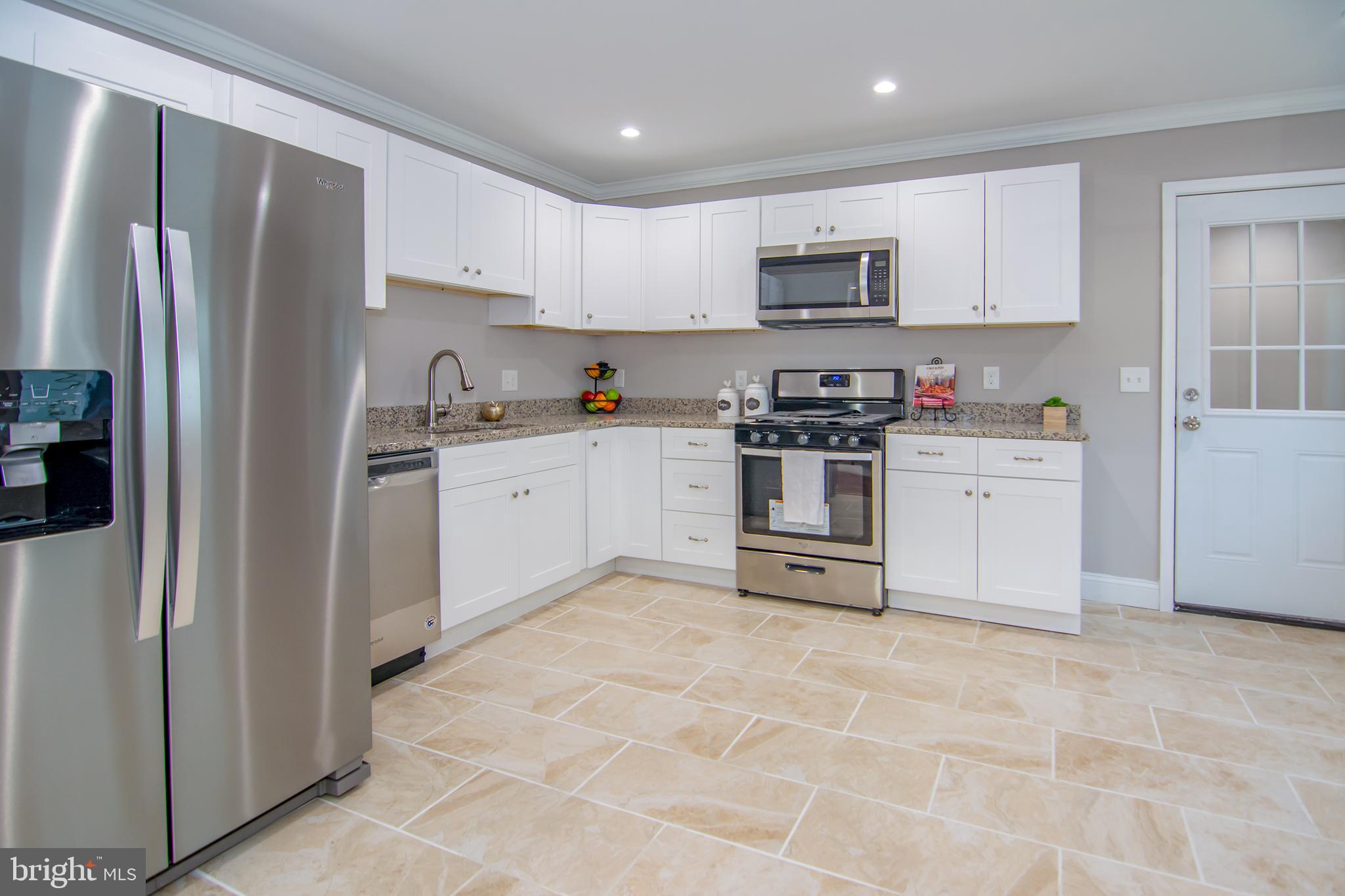 5 Clipper Road Essex, MD 21221 - Photo 4 of 51 Open Kitchen... Door to rear room / laundry area