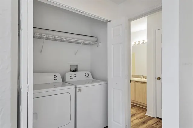 a view of storage and utility room with washer and dryer