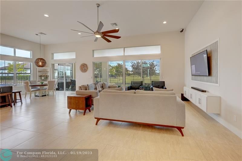 1000 Hookline Circle Loxahatchee, FL 33470 - Photo 21 of 98 a living room with furniture and a large window