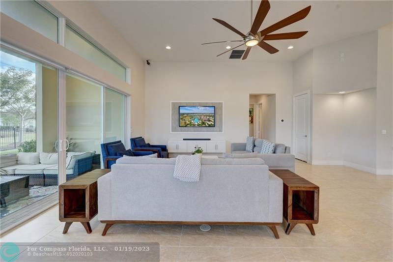 1000 Hookline Circle Loxahatchee, FL 33470 - Photo 23 of 98 a living room with furniture a window and a ceiling fan