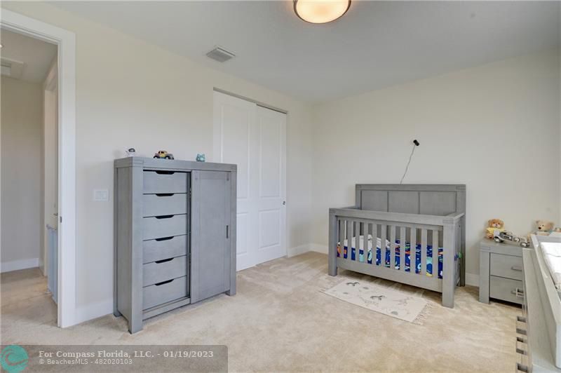 1000 Hookline Circle Loxahatchee, FL 33470 - Photo 45 of 98 a view of room with baby crib and a couch