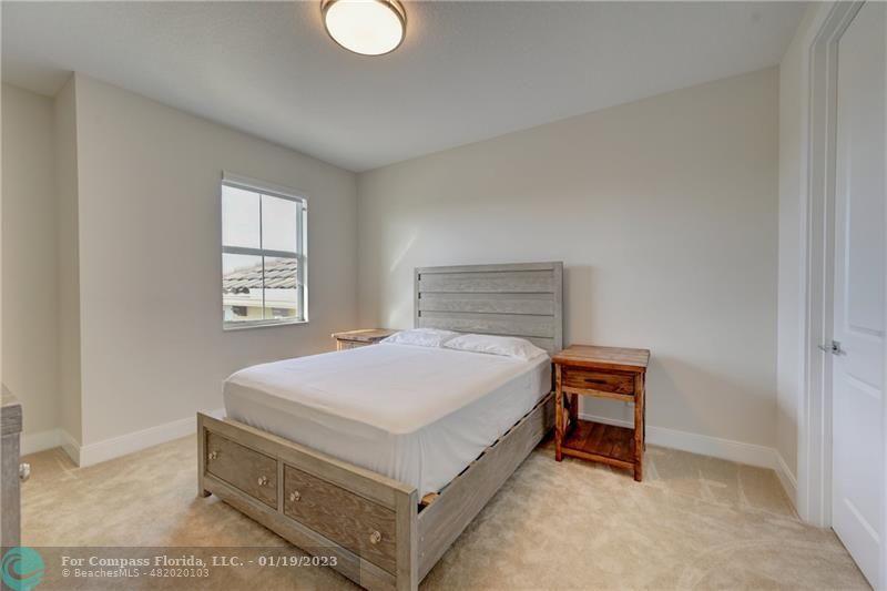 1000 Hookline Circle Loxahatchee, FL 33470 - Photo 47 of 98 a bedroom with a bed and a window