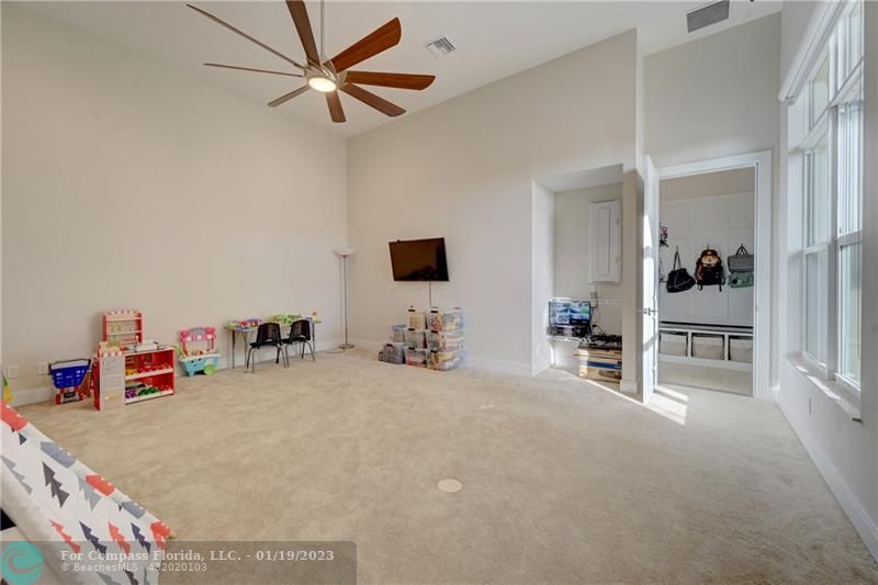 1000 Hookline Circle Loxahatchee, FL 33470 - Photo 58 of 98 wooden floor with furniture and a flat screen tv