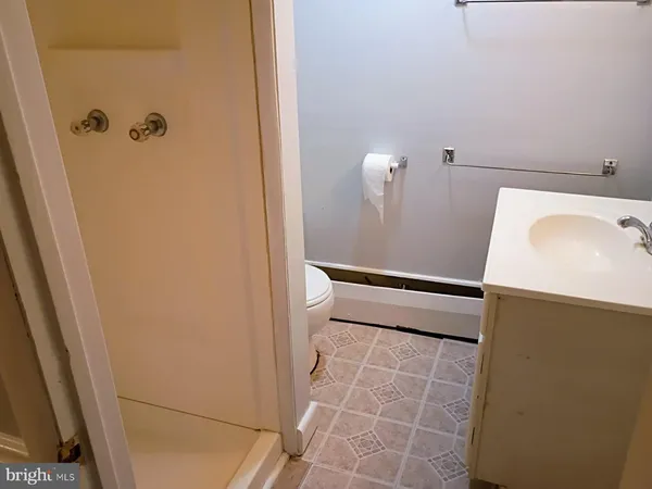 a bathroom with a sink and shower