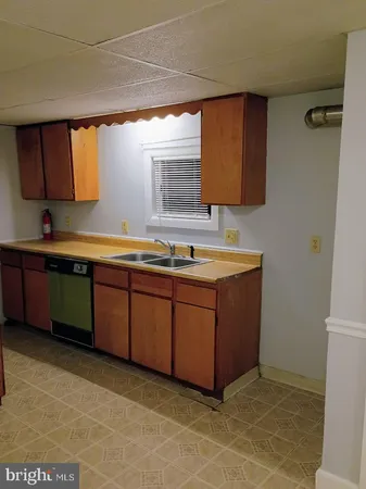 a room with a sink a vanity and mirror
