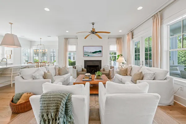 a view of a house with backyard sitting area and garden