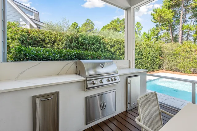 a large white bed sitting in a room next to a window